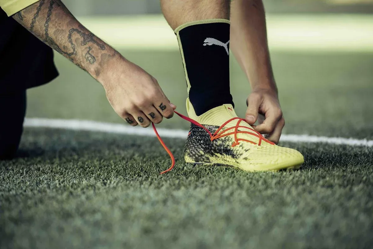 How do I tie my football boots?