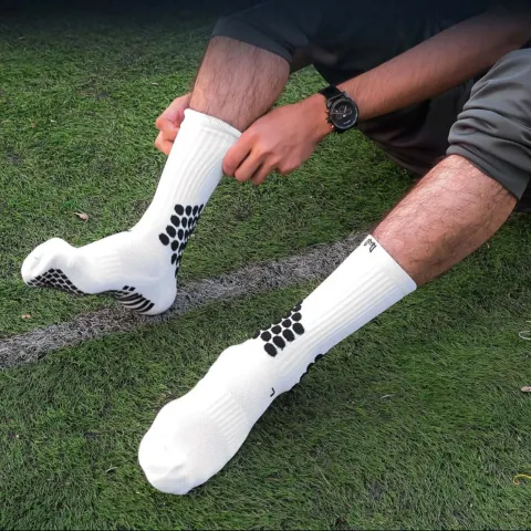medicaptain grip socks being worn by a man on a field